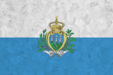 san marino flag depicted in bright paint colors on old relief plastering wall. textured banner on ro