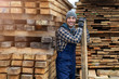 © pikselstock - Young male worker in timber warehouse