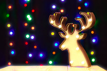 Lamp Deer Illuminated By Bulbs On The Background Of Garland Lights Creates A Festive Mood