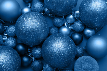 Christmas decorations. Christmas balls in toned blue color of the year 2020.