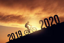 2020 New Year Concept With The Silhoutte Of A Bicycle Rider, Metmorphing The Changes Of Years