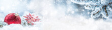 Red Christmas Ball On Snow With Fir Branches. Merry Xmas Concept - Panoramic Banner