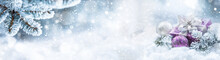 Purple Christmas Gift And Balls On Snow With Fir Branches. Merry Xmas Concept- Panoramic Banner