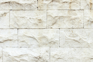 the wall is faced with stone tiles