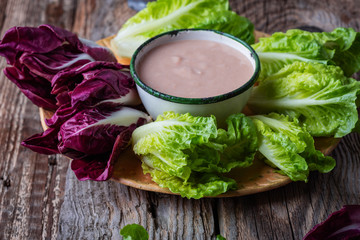 Fresh baby radicchio and lettuce with white bean dressing  and sunflower seeds