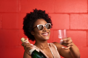 Wall Mural - Attractive young african american woman celebrating New year's e