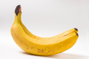 two ripe bananas on a white background