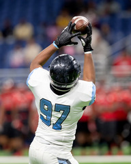 Wall Mural - Great action photos of high school football players making amazing plays during a football game