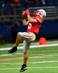 Wall Mural - Great action photos of high school football players making amazing plays during a football game