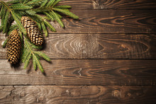 Fir Branches And Cone On Dark Old Wooden Background