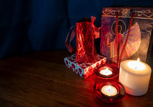 Three Candles Light Up Christmas Gifts And Presents Scene