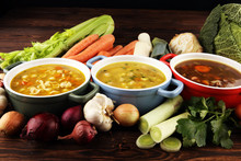 Set Of Soups From Worldwide Cuisines, Healthy Food. Broth With Noodles, Beef Soup And Broth With Marrow Dumplings. All Soups With Healthy Vegetables On Table