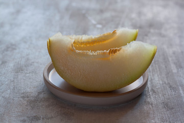 ripe and juicy melon on wooden table