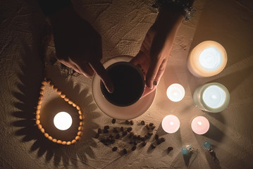 Canvas Print - Coffee grounds fortune telling close up. Fortune teller with a cup of coffee.