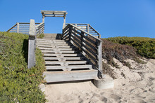Old Outdoor Wooden Staircase At A Sandy Beach