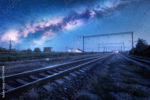 Fotomural Milky Way over the railway station at starry night