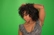 © Mark Adams - Beautiful black woman in a floral dress posing on green screen