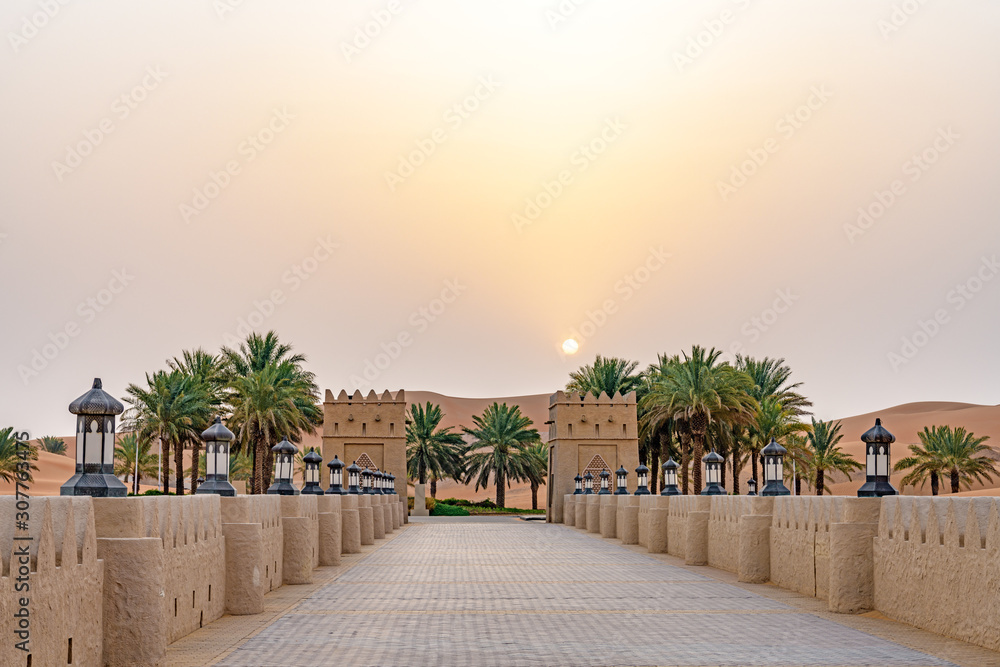 Qasr Al Sarab in Liwa, Al Dhafra, Abu Dhabi, United Arab Emirates at sunrise. - obrazy, fototapety, plakaty 