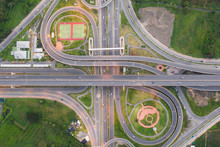Aerial View Of Highway Junctions Top View Of Urban City, Bangkok At Evening, Thailand. Car And Truck Across Road Junction, Traffic Abstract And Transportation Concept..