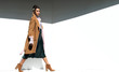 © Agnes Lopez - beautiful young fashionable woman walking in wall clothes