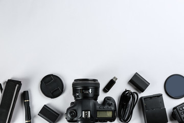 Wall Mural - flat lay composition with equipment for professional photographer on white background. space for tex
