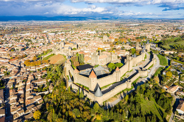 Aerial view of Cite de Carcassonne, a medieval hilltop citadel in the French city of Carcassonne, Aude, Occitanie, France. Founded in the Gallo-Roman period, the town is fortified by two castle walls