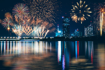 Business district of Vienna with skyscrapers and fireworks. New Year's eve concept. 