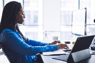 Wall Mural - Businesswoman typing report on computer