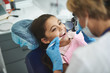 © Yakobchuk Olena - Smiling girl is enjoying visit to dentist