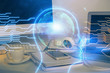 © peshkova - Double exposure of table with computer and brain hologram. Data innovation concept.