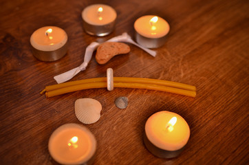 Wall Mural - Lighted candles and paraphernalia for the magic rite. Ring made of natural stone. 