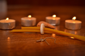 Wall Mural - Lighted candles and paraphernalia for the magic rite. Ring made of natural stone. 