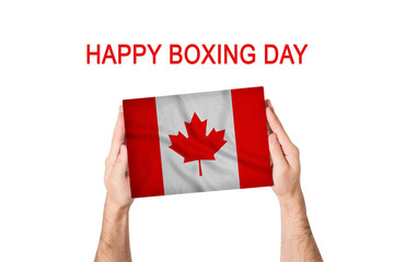 Happy boxing day. Box with Canada flag in male hands. White background