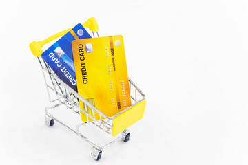 Cart and credit card on white background