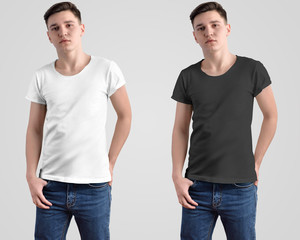 Wall Mural - Design mockup of a white and black t-shirt on a young guy.