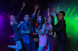 © May Chanikran - Holiday travel celebrations concept, group of people dancing together with enjoying at colourful night party club.