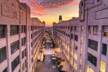 A row of buildings at sunset aerial.