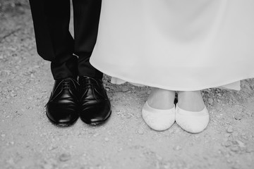 Wall Mural - bride and groom showing their shoes