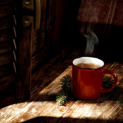 Wall Mural - Red mug of winter hot mulled and window sill background. 