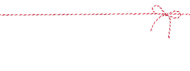 rot-weiß gestreifte Kordel mit Schleife vor weißem Hintergrund