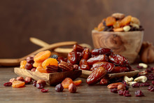 Various Dried Fruits And Nuts In Wooden Dish.