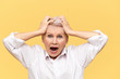 Stressed angry retired woman shouting and pulling hair off having furious desperate look, suffering from headache, expressing negative reaction. Stress, despair, nervous wreck and breakdown