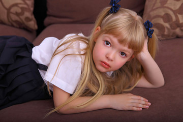 nice cute sweet tender cheerful positive small little girl with curly pony-tails in white formal shi