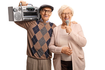 Wall Mural - Senior couple with microphone and boombox