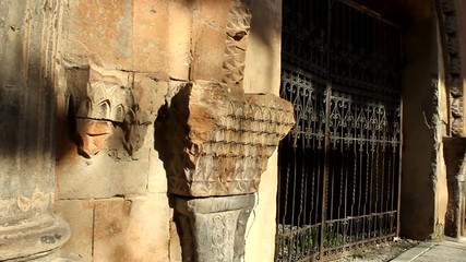 Wall Mural - An Old Cathedral Entrance In Yuriy Gyumri, Armenia With Closed Metal, Black Gates - Wide Pan Shot