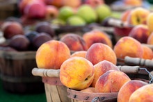 Displays Of Fresh Harvested Peaches, Plums, Pears And Apples For Sale At A Local Farmers Market