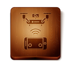 Canvas Print - Brown Remote aerial drone with a camera taking photography or video recording icon isolated on white background. Wooden square button. Vector Illustration