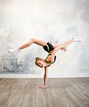 Flexible Cute Little Girl Child Gymnast Doing Acrobatic Exercise