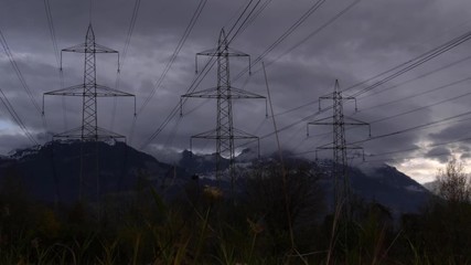 Wall Mural - Time-lapse over three high voltage power lines in the mountains. 
