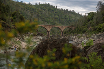 Wall Mural - Images of an old bridge over a river